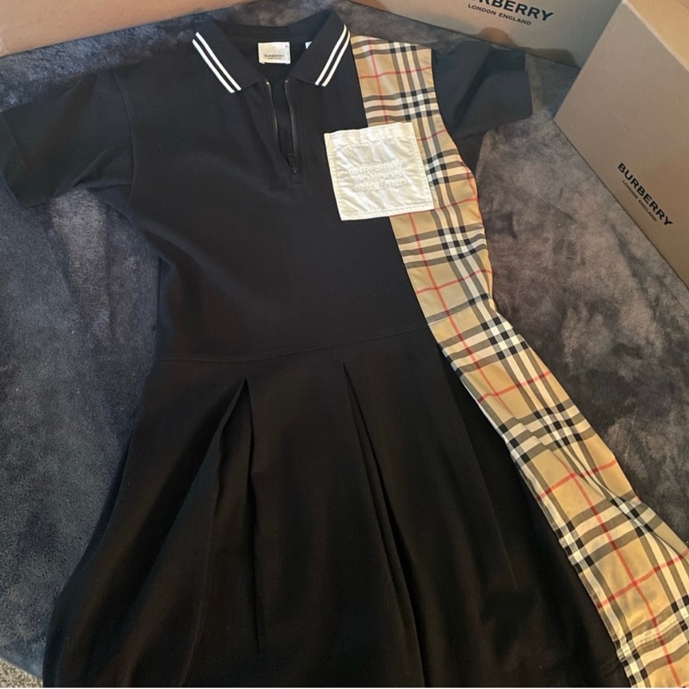 Authentic Burberry dress size 12 runs small worn twice. GREAT CONDITION.